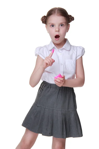 Lovely schoolgirl posing with pink paint — Stock Photo, Image