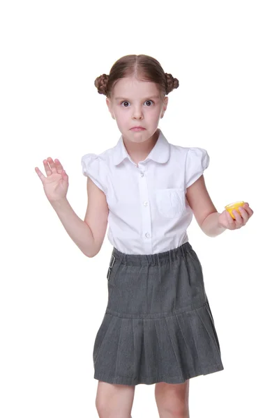 Lovely schoolgirl posing with finger painted in yellow — Stock Photo, Image