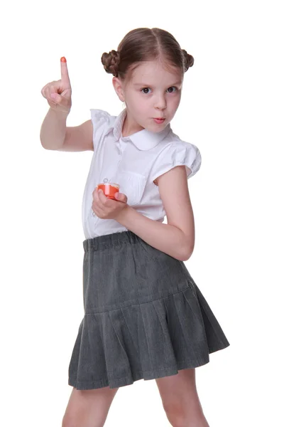 Lovely schoolgirl posing with orange paint — Stock Photo, Image