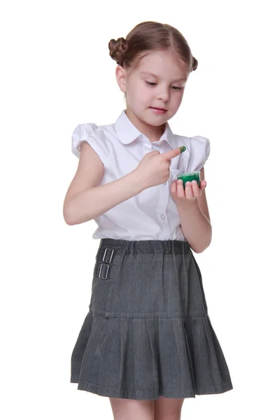 Lovely schoolgirl posing with green paint — ストック写真