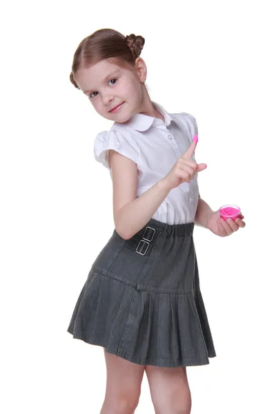 Lovely schoolgirl posing with pink paint — Stock Photo, Image