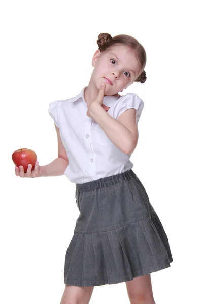 Portrait d'une belle écolière tenant une pomme — Photo