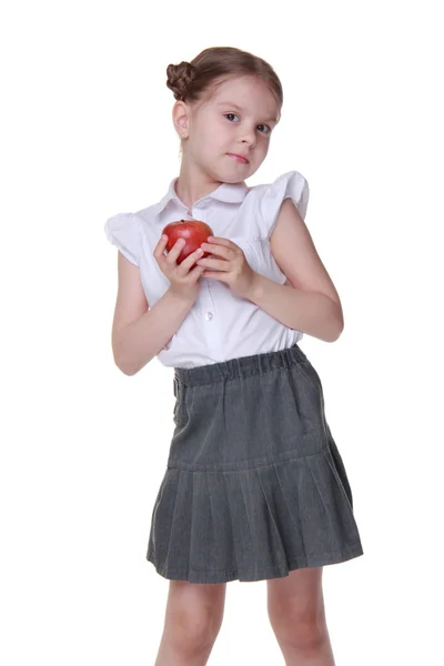 Portrait of a beautiful schoolgirl holding an apple — Stock Photo, Image