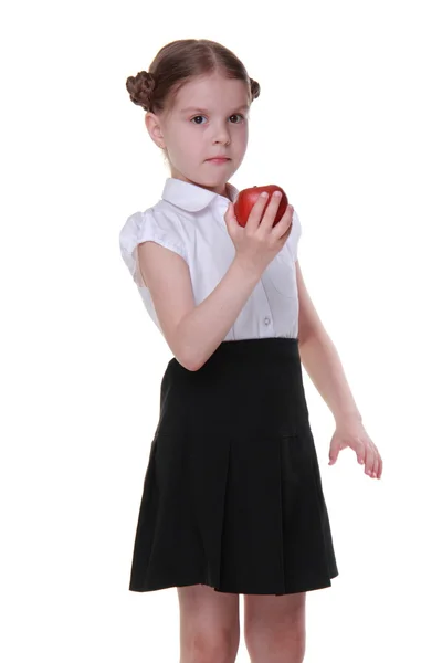Portrait d'une belle écolière tenant une pomme — Photo