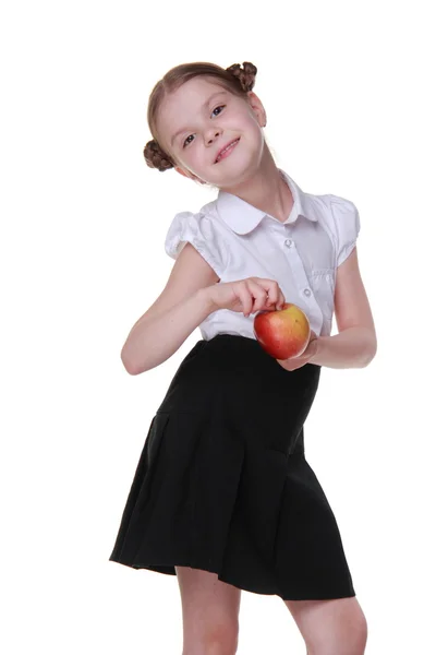 Portret pięknej uczennicy trzyma jabłko — Zdjęcie stockowe