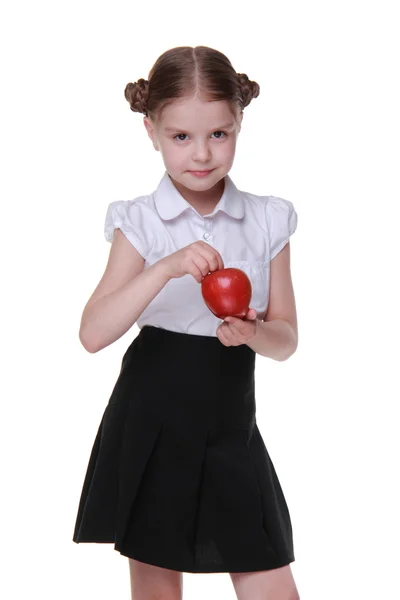 Retrato de uma bela colegial segurando uma maçã — Fotografia de Stock