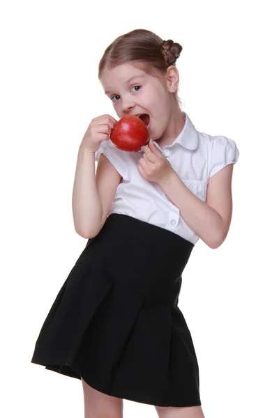 Portrét krásné školačky drží jablko — Stock fotografie