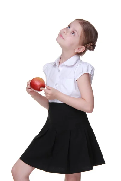 Retrato de una hermosa colegiala sosteniendo una manzana —  Fotos de Stock