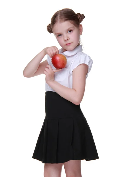 Retrato de una hermosa colegiala sosteniendo una manzana —  Fotos de Stock