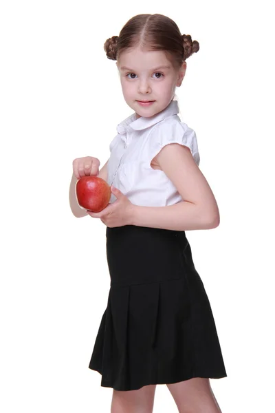 Retrato de una hermosa colegiala sosteniendo una manzana —  Fotos de Stock