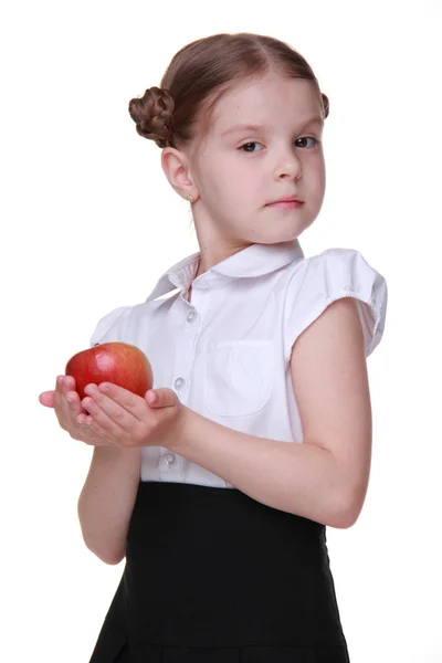 Portrait of a beautiful schoolgirl holding an apple — Stock Photo, Image