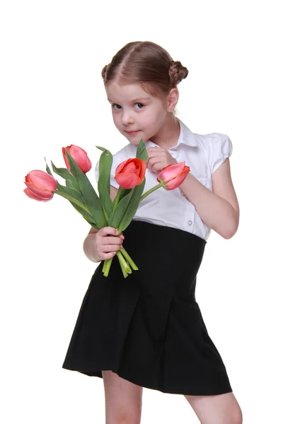 Estudante bonito com um buquê de tulipas — Fotografia de Stock