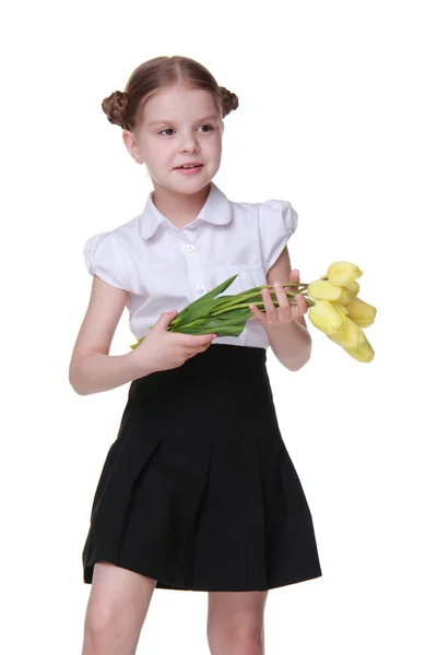 Estudante bonito com um buquê de tulipas — Fotografia de Stock