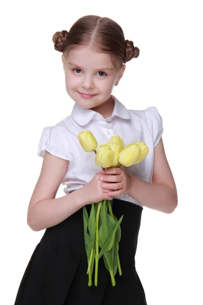 Estudante bonito com um buquê de tulipas — Fotografia de Stock