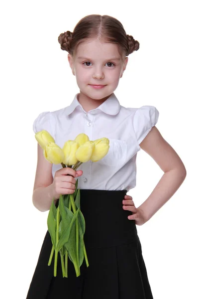 Estudante bonito com um buquê de tulipas — Fotografia de Stock