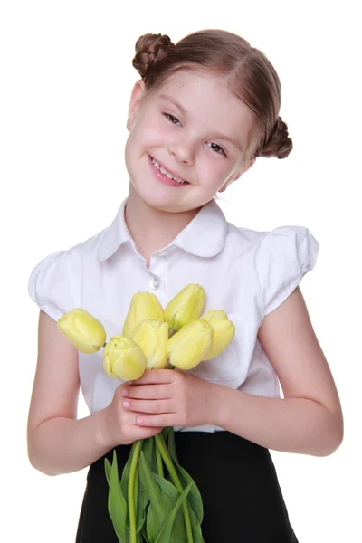 Roztomilá školačka s kyticí tulipánů — Stock fotografie