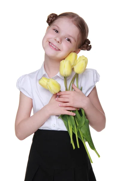 Ładny uczennica z bukietem tulipanów — Zdjęcie stockowe