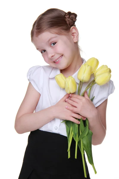 Anime schoolgirl met een boeket van tulpen — Stockfoto