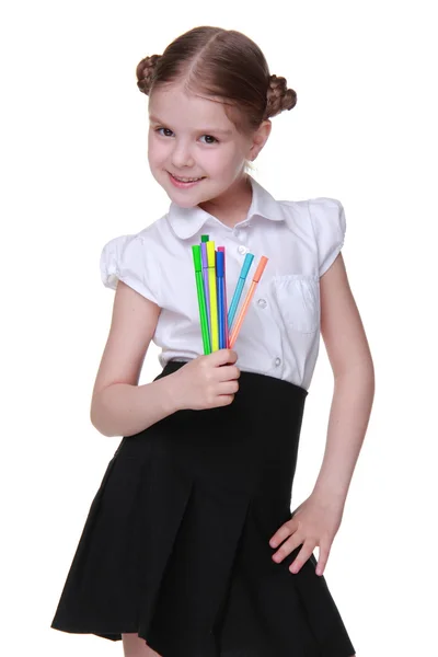 Studio portrait of schoolgirl with felt-tip pens — Stock Photo, Image