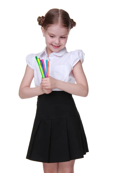 Studio portrait of schoolgirl with felt-tip pens — Stock Photo, Image