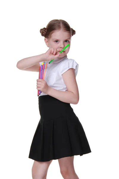 Studio portrait of schoolgirl with felt-tip pens — Stock Photo, Image