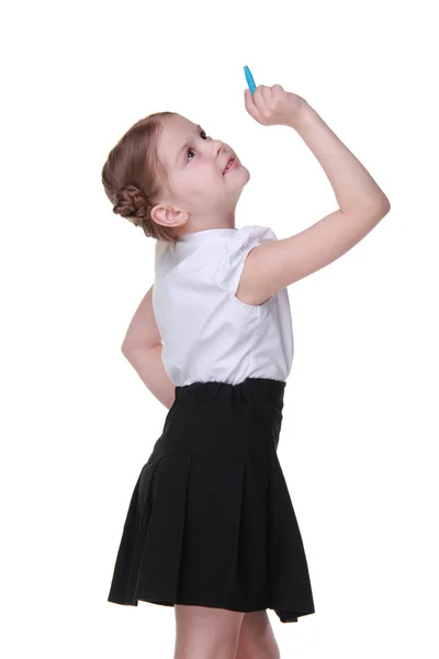 Little schoolgirl writes with chalk — Stock Photo, Image