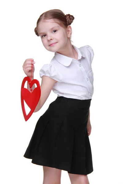 Caucasico bella studentessa holding rosso cuore simbolo — Foto Stock