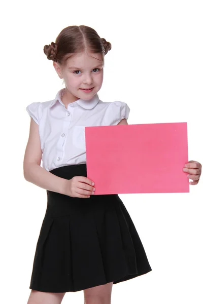 Colegiala feliz con una hoja de papel —  Fotos de Stock