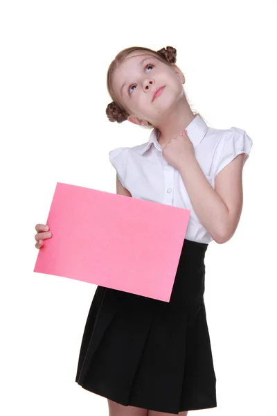 Glückliches Schulmädchen mit einem Blatt Papier — Stockfoto