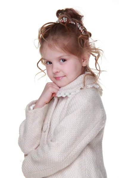 Beautiful little girl in a light coat — Stock Photo, Image