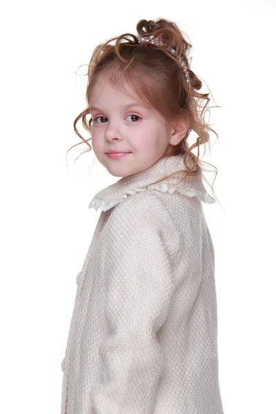 Beautiful little girl in a light coat — Stock Photo, Image