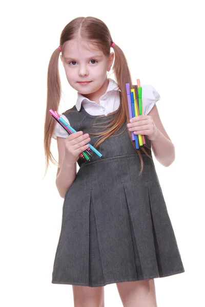 Studio portrait of schoolgirl with felt-tip pens — Stock Photo, Image