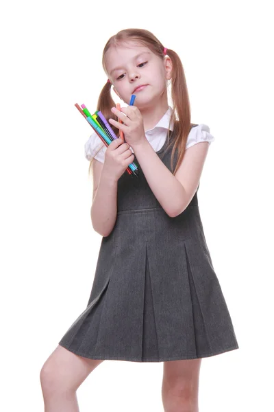 Studio portrait of schoolgirl with felt-tip pens — Stock Photo, Image