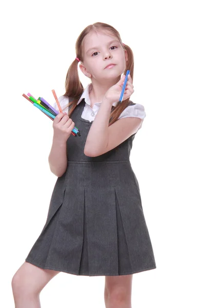 Studio portrait of schoolgirl with felt-tip pens — Stock Photo, Image