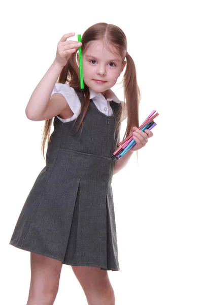 Studio portrait of schoolgirl with felt-tip pens — Stock Photo, Image