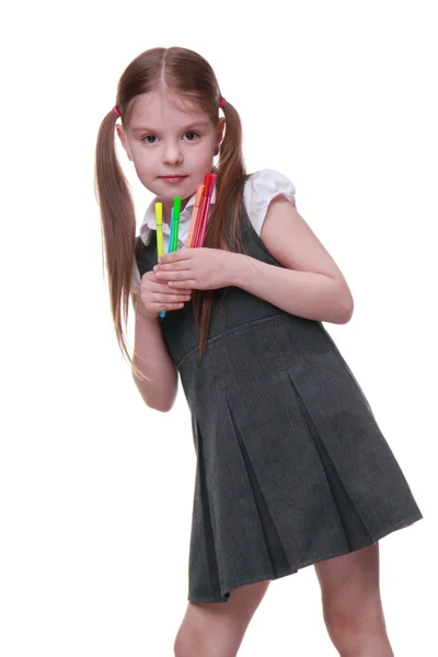 Studio portrait of schoolgirl with felt-tip pens — Stock Photo, Image