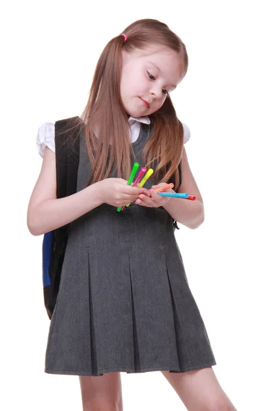 Studio portrait of schoolgirl with felt-tip pens — Stock Photo, Image