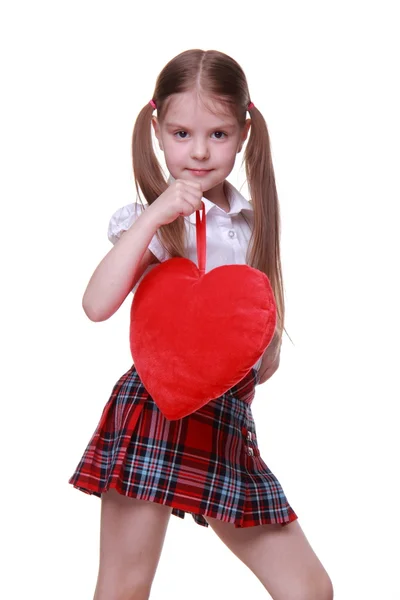 Caucasian young girl with red heart — Stock Photo, Image
