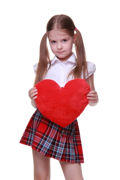 Caucasian young girl with red heart — Stock Photo, Image