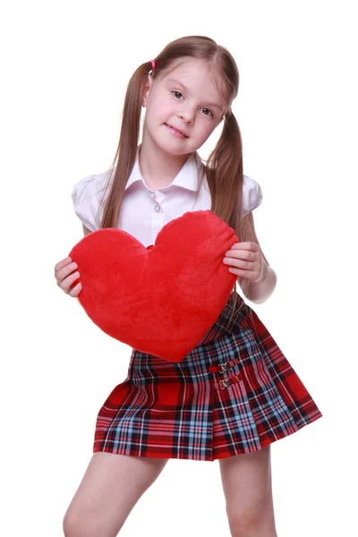 Caucasian young girl with red heart — Stock Photo, Image
