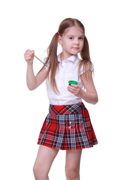 Cute girl holding paints and brush — Stock Photo, Image