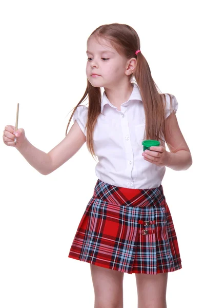 Cute little girl holding watercolor and brush — Stock Photo, Image