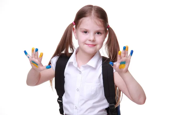 Happy little girl with hands painted as ukrainian flag — Stock Photo, Image