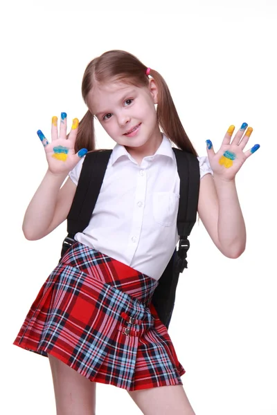 Happy little girl with hands painted as ukrainian flag — Stock Photo, Image