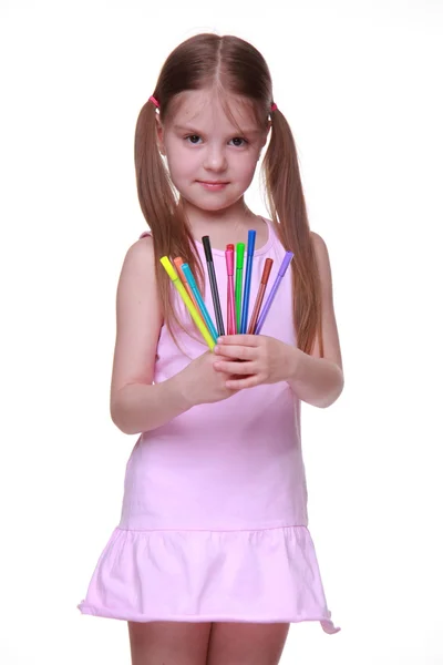 Studio portrait of little girl with felt-tip pens — Stock Photo, Image