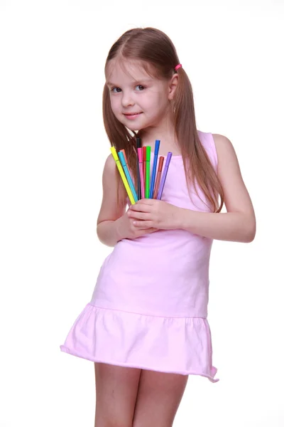 Studio portrait of little girl with felt-tip pens — Stock Photo, Image