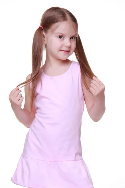 Studio portrait of little girl in pink dress — Stock Photo, Image