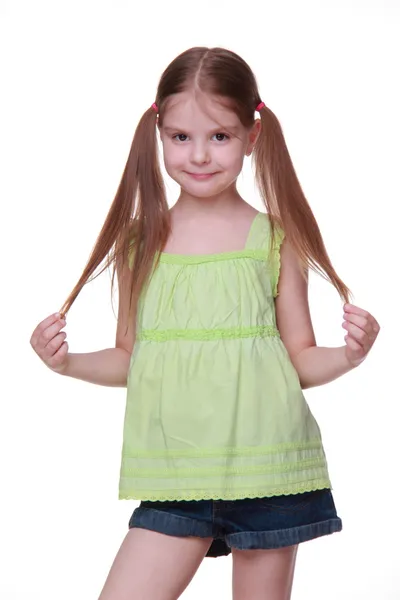 Studio portrait of little girl in green shirt — Stock Photo, Image