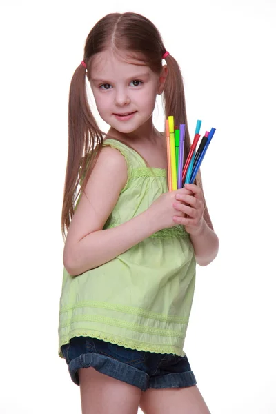 Studio portrait of little girl with felt-tip pens — Stock Photo, Image