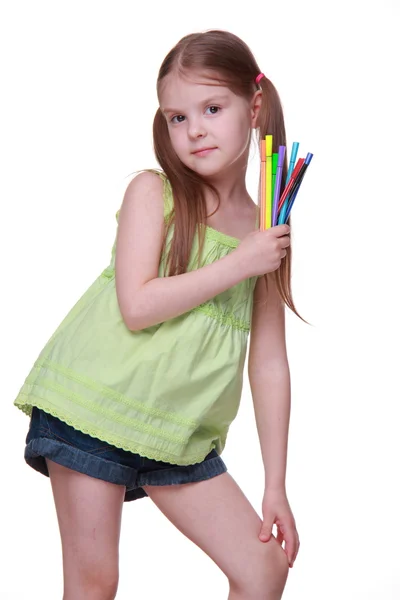 Studio portrait of little girl with felt-tip pens — Stock Photo, Image